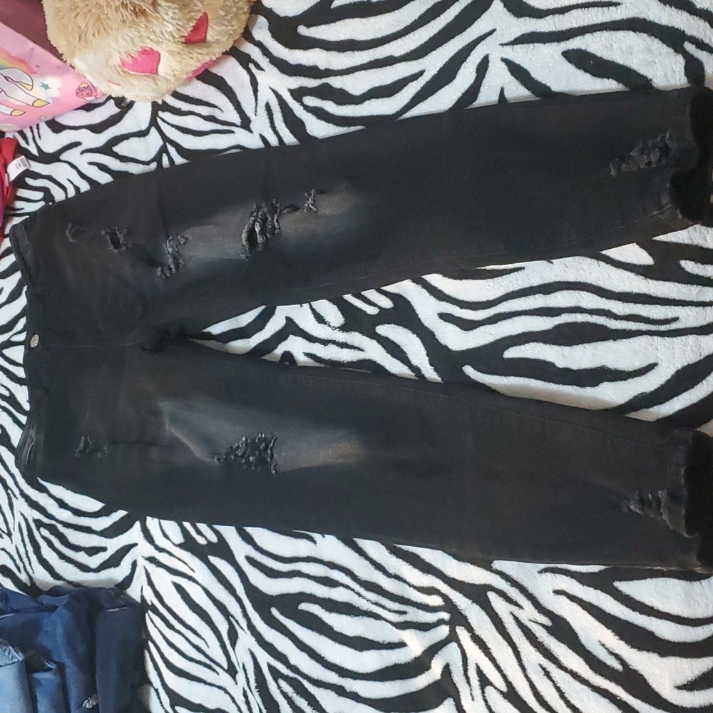 Never worn. Black faded ripped skinny jeans. Size Small.